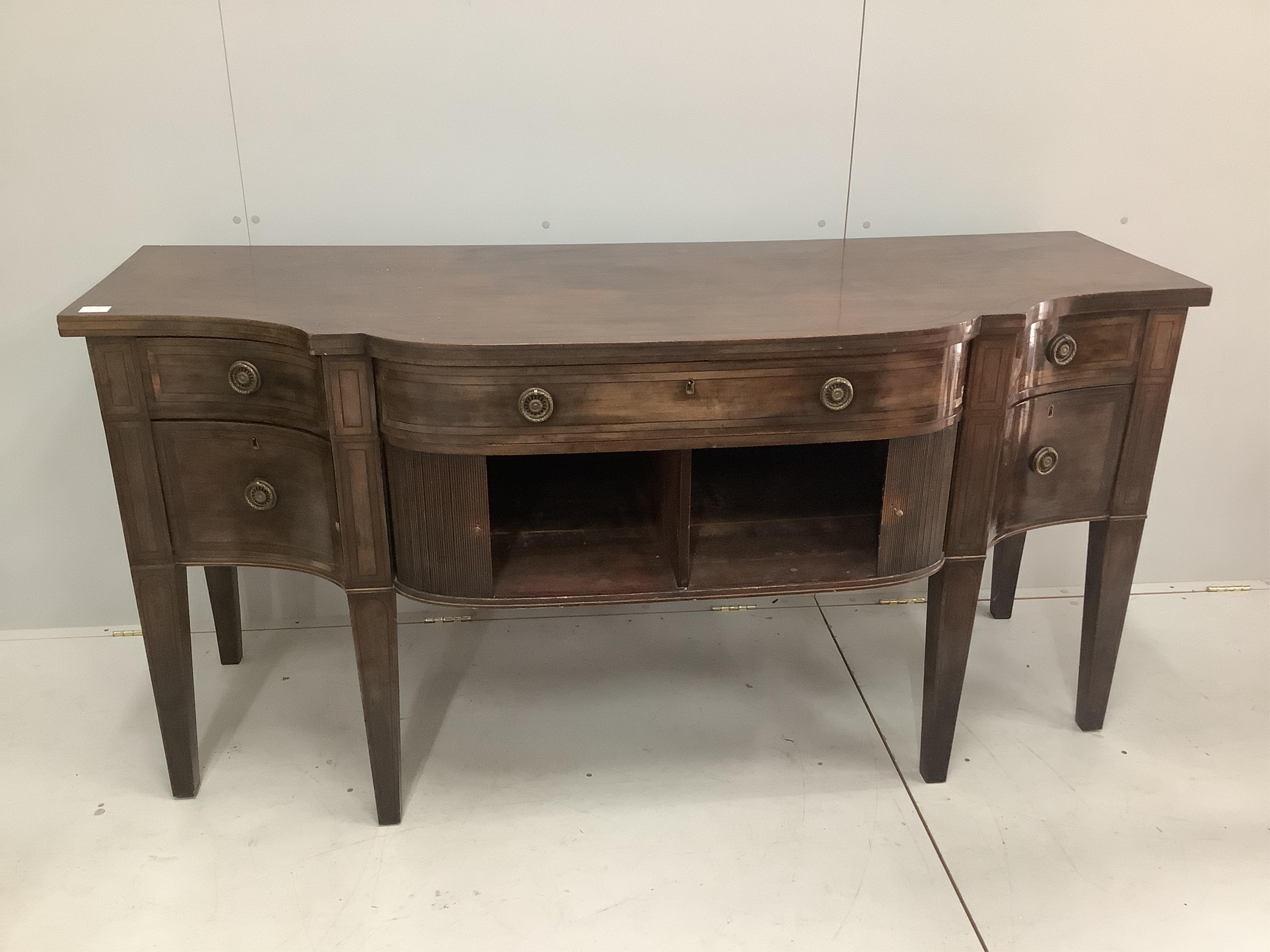 A George III mahogany bow front sideboard, width 183cm, depth 69cm, height 88cm. Condition - fair